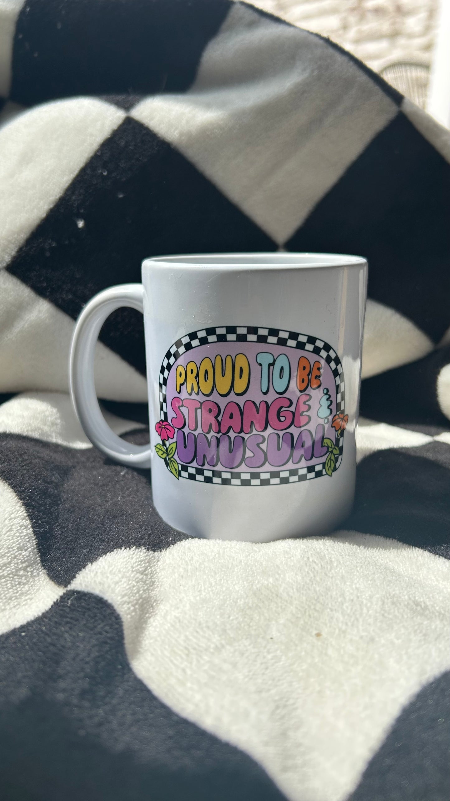 Proud to be strange and unusual mug