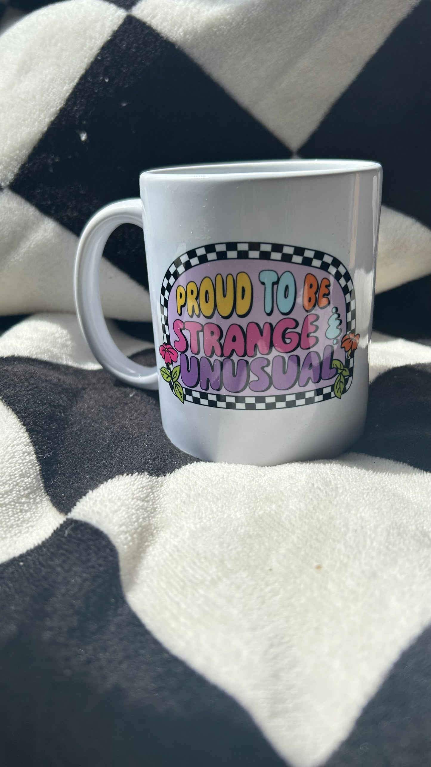 Proud to be strange and unusual mug